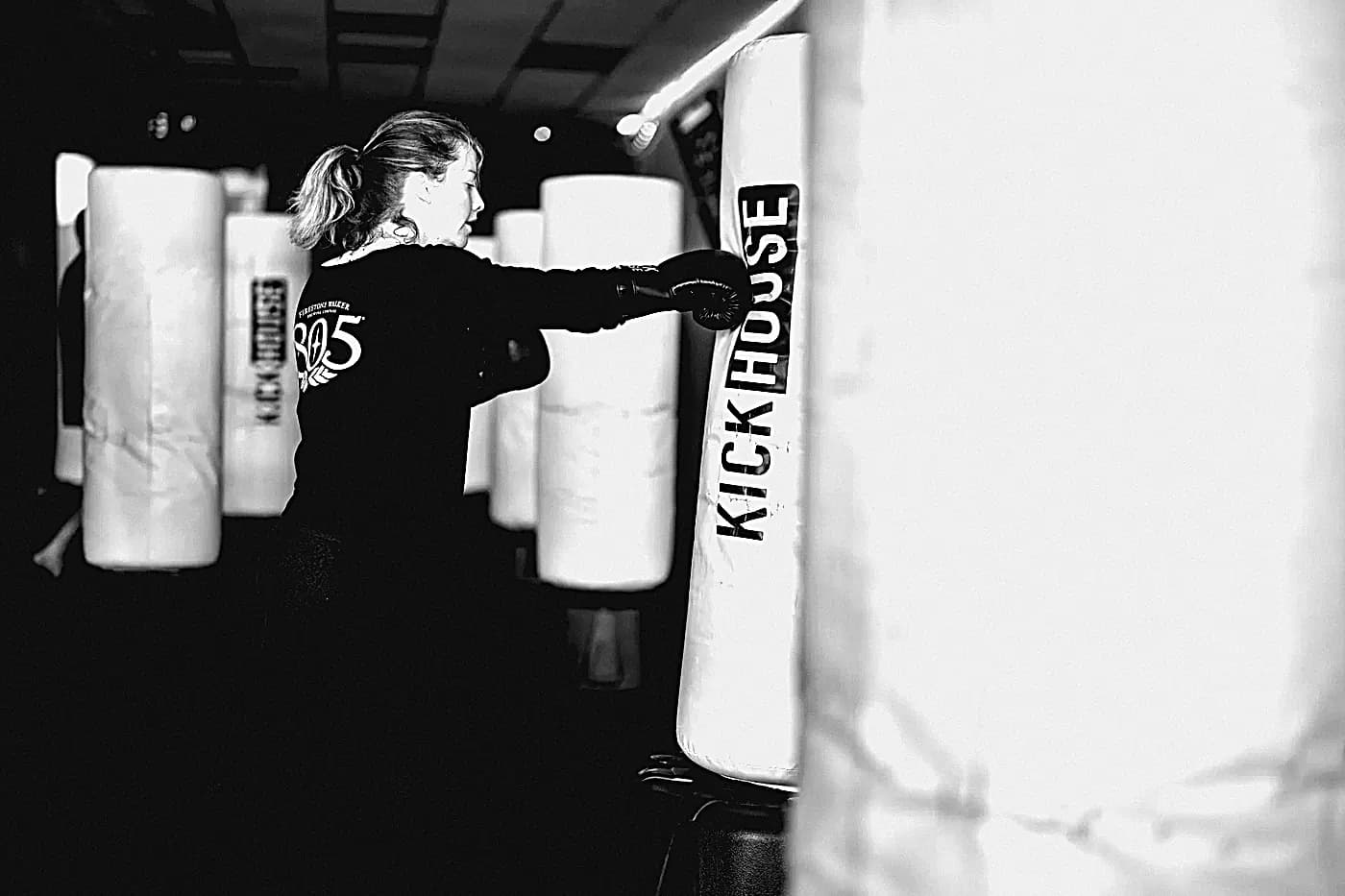A member striking a KickHouse heavy bag