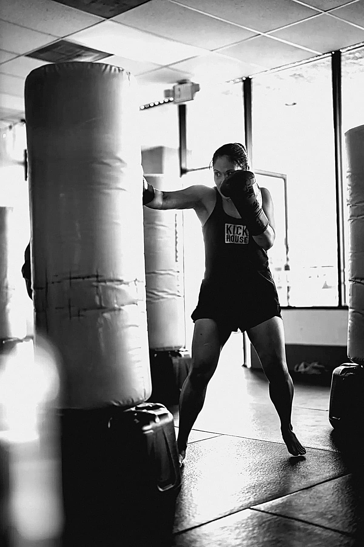 A member working a free-standing heavy bag
