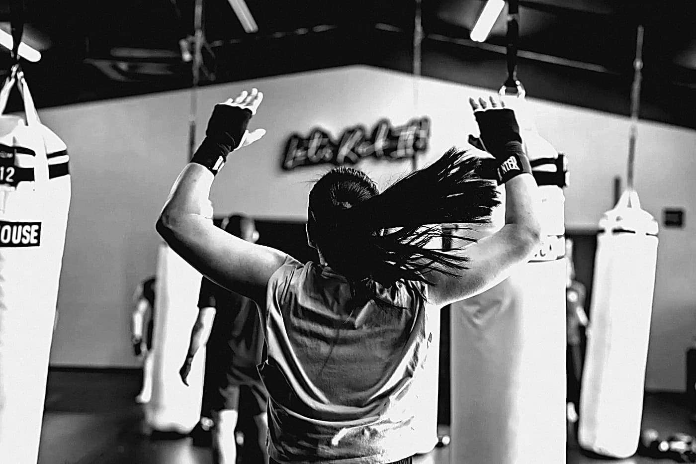 A member with both gloves raised in class